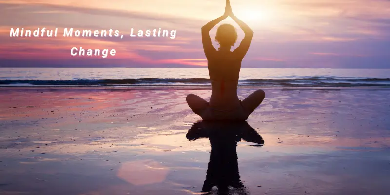 Mindfulness Awareness Habit Change Pause Person meditating on a beach at sunset, symbolizing mindfulness and inner calm.